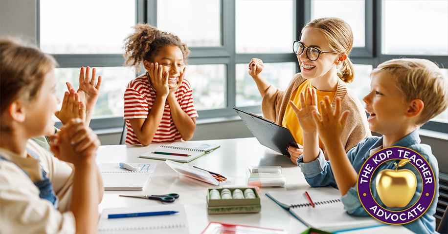Children at a round table working on project